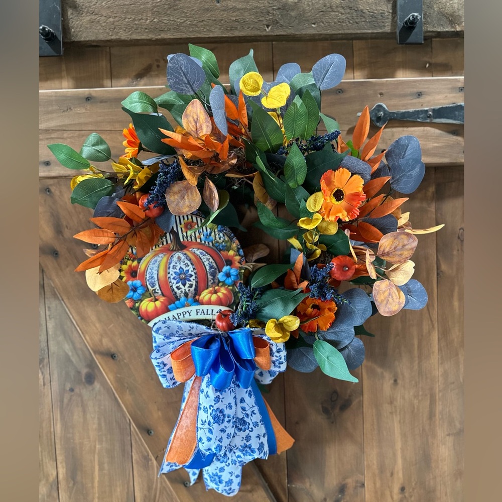 Vibrant Floral Wreath with Blue and Orange Accents